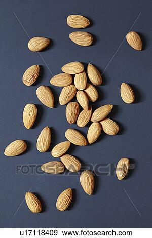 Stock Photo - Almonds on black background. Fotosearch