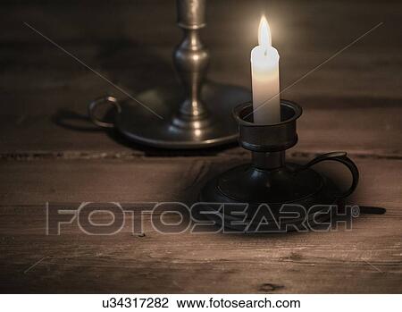 Stock Image - Antique candlestick holder. Fotosearch