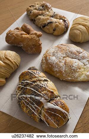 Assorted pastries on waxed paper View Large Photo Image Stock Image - Assorted pastries on waxed paper. Fotosearch