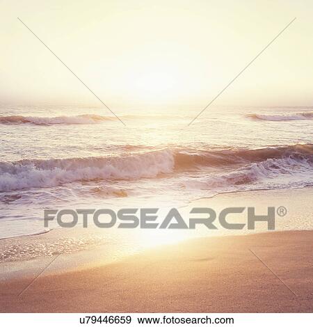 Stock Photo - Beach at sunset. Fotosearch
