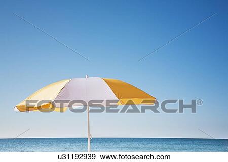 Beach umbrella by sea View Large Photo Image Stock Photo - Beach umbrella by sea. Fotosearch