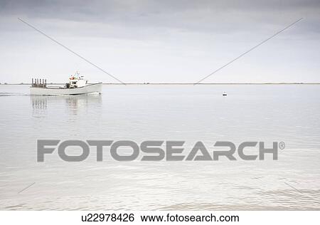 Stock Photograph - Boat in bay. Fotosearch