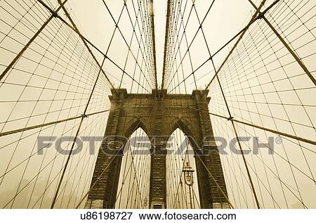 Stock Photo - Brooklyn Bridge at dusk. Fotosearch