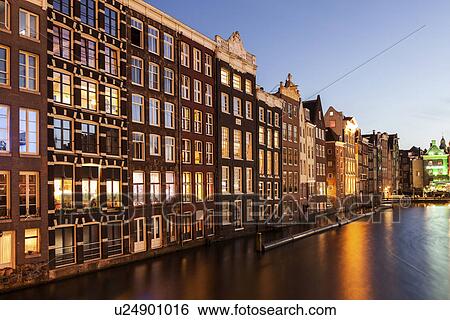 Buildings by canal at sunrise View Large Photo Image Stock Photograph - Buildings by canal at sunrise. Fotosearch
