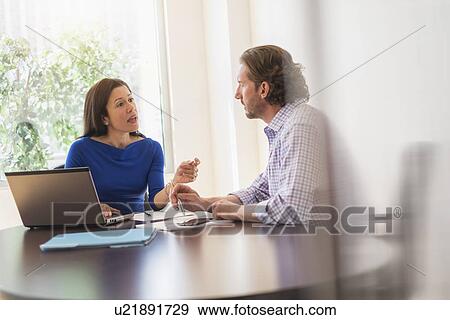 Stock Photo - Business people at meeting. Fotosearch