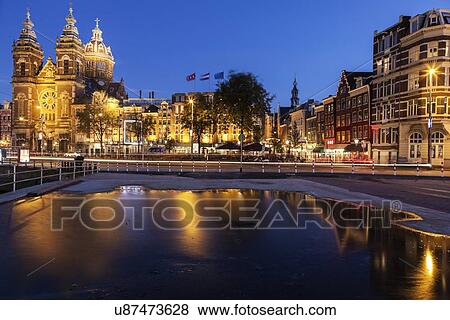 Canal and illuminated buildings at sunrise View Large Photo Image Stock Photo - Canal and illuminated buildings at sunrise. Fotosearch