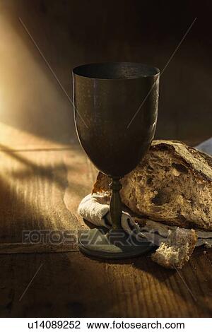 Close up of chalice and bread on table View Large Photo Image Stock Image - Close up of chalice and bread on table. Fotosearch