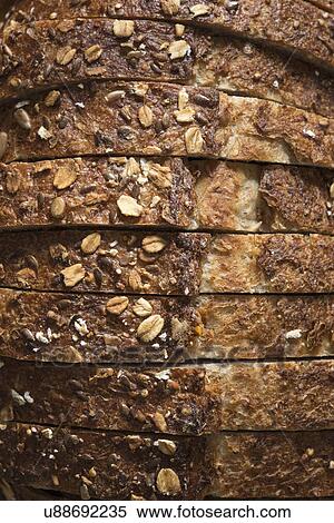 Close-up of sliced whole grain oat bread View Large Photo Image Stock Photography - Close-up of sliced whole grain oat bread. Fotosearch