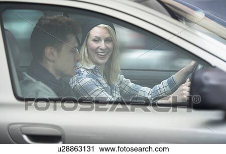 Stock Image - Couple driving car. Fotosearch