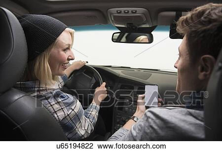 Stock Image - Couple driving car. Fotosearch