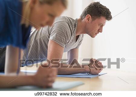 Couple exercising View Large Photo Image Stock Image - Couple exercising. Fotosearch