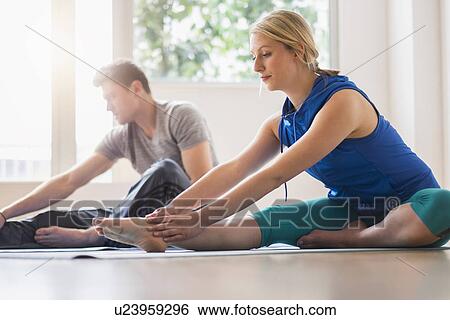 Couple exercising View Large Photo Image Stock Photograph - Couple exercising. Fotosearch