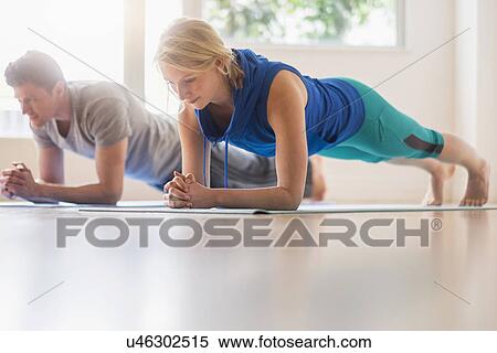 Couple exercising View Large Photo Image Stock Photography - Couple exercising. Fotosearch