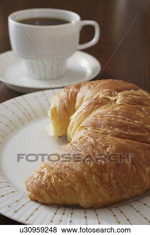 Croissant and coffee View Large Photo Image Stock Photo - Croissant and coffee. Fotosearch