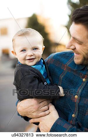 Father holding baby son (6-11 months) View Large Photo Image Stock Image - Father holding baby son (6-11 months). Fotosearch