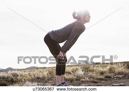 Female runner taking a break View Large Photo Image Stock Photo - Female runner taking a break. Fotosearch