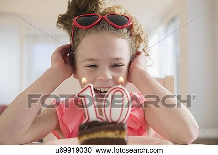 Girl (10-11) celebrating 10th birthday View Large Photo Image Stock Image - Girl (10-11) celebrating 10th birthday. Fotosearch