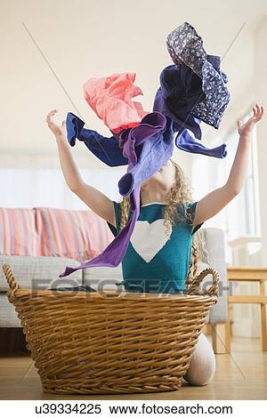 Girl (10-11) throwing up clothes View Large Photo Image Stock Photography - Girl (10-11) throwing up clothes. Fotosearch