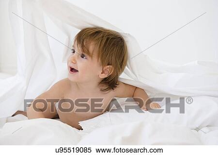 Girl (2-3) playing on bed View Large Photo Image Stock Photography - Girl (2-3) playing on bed. Fotosearch