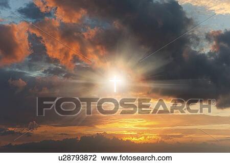 Glowing cross sign in clouds at sunset View Large Photo Image Stock Image - Glowing cross sign in clouds at sunset. Fotosearch
