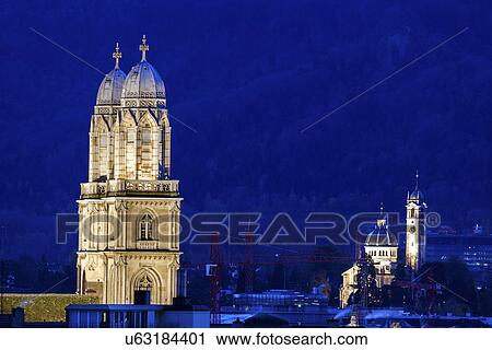 Stock Image - Grossmunster Church bell towers against night sky. Fotosearch