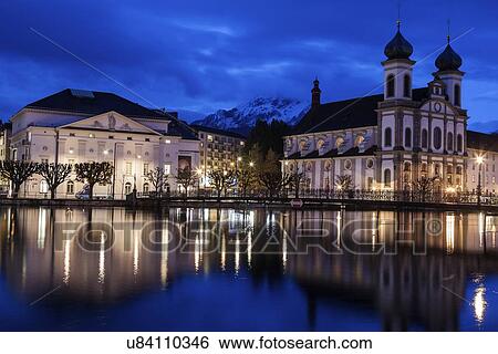 Illuminated building reflecting in lake View Large Photo Image Stock Photograph - Illuminated building reflecting in lake. Fotosearch