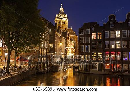 Illuminated buildings by canal at night View Large Photo Image Stock Photography - Illuminated buildings by canal at night. Fotosearch