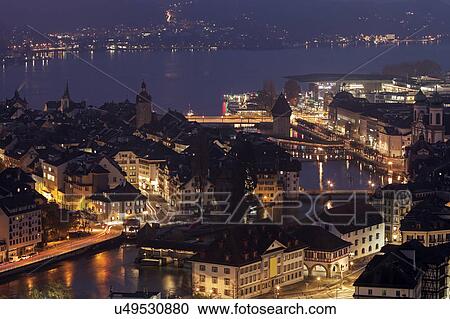 Illuminated lakeside cityscape View Large Photo Image Stock Image - Illuminated lakeside cityscape . Fotosearch