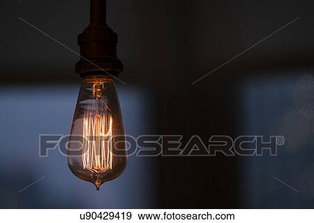 Illuminated light bulb View Large Photo Image Stock Photo - Illuminated light bulb. Fotosearch