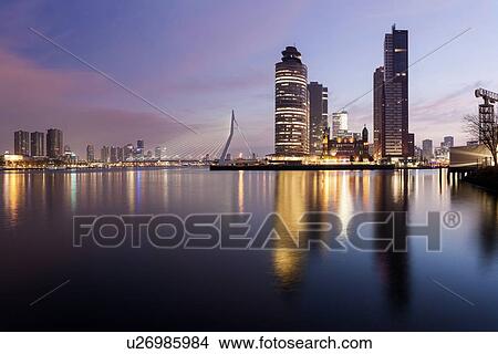 Picture - Illuminated skyscrapers reflecting in water. Fotosearch