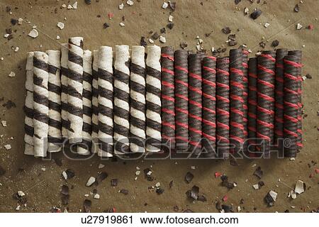 Italian rolled wafer cookies and crumbs on baking paper View Large Photo Image Stock Image - Italian rolled wafer cookies and crumbs on baking paper. Fotosearch