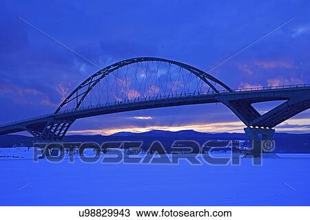 Stock Image - Lake Champlain Bridge connecting New York and Vermont States at dusk. Fotosearch