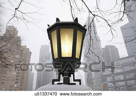 Stock Image - Low-angle view of antique lantern. Fotosearch