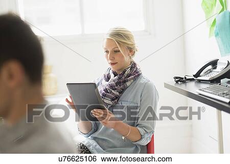 Man and woman working in office View Large Photo Image Stock Photograph - Man and woman working in office. Fotosearch