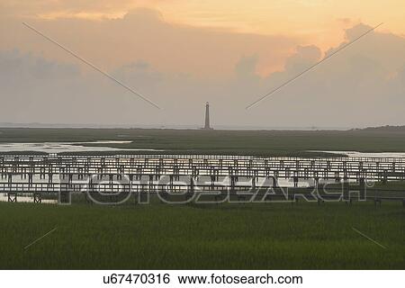 Morris Island Lighthouse across inlet at dawn View Large Photo Image Stock Photograph - Morris Island Lighthouse across inlet at dawn. Fotosearch