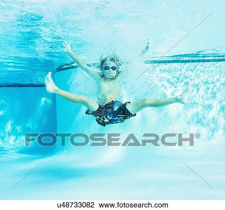 Portrait of boy (8-9) in swimming pool View Large Photo Image Stock Image - Portrait of boy (8-9) in swimming pool. Fotosearch