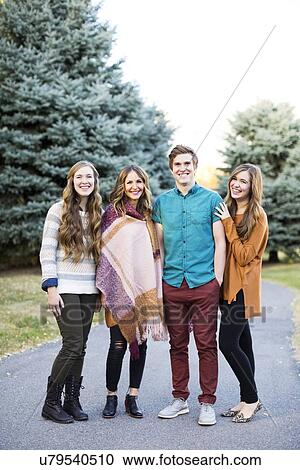 Portrait of four friends smiling View Large Photo Image Stock Image - Portrait of four friends smiling. Fotosearch
