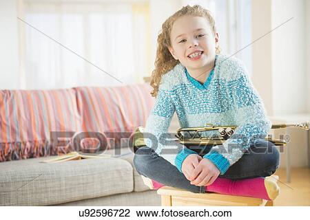 Portrait of girl (10-11) with trumpet View Large Photo Image Stock Image - Portrait of girl (10-11) with trumpet. Fotosearch