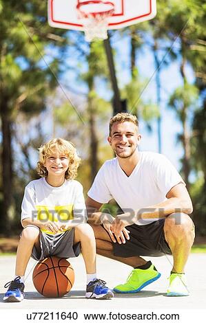 Portrait of man with his younger brother (8-9) View Large Photo Image Stock Image - Portrait of man with his younger brother (8-9). Fotosearch