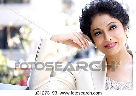 Stock Image - Portrait of mature woman. Fotosearch