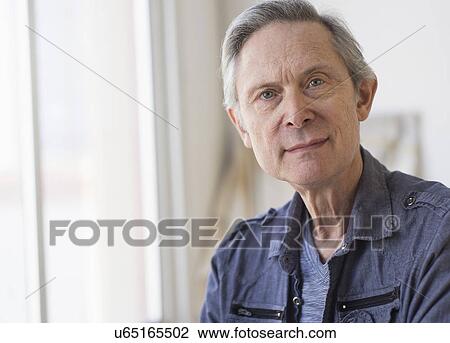 Portrait of senior man indoors View Large Photo Image Stock Image - Portrait of senior man indoors. Fotosearch