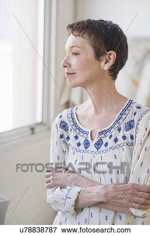 Stock Photo - Portrait of senior woman indoors. Fotosearch