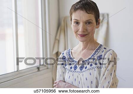 Stock Photograph - Portrait of senior woman indoors. Fotosearch