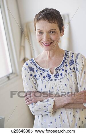 Portrait of senior woman indoors View Large Photo Image Stock Photography - Portrait of senior woman indoors. Fotosearch