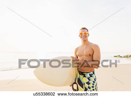 Portrait of surfer on beach View Large Photo Image Stock Image - Portrait of surfer on beach. Fotosearch