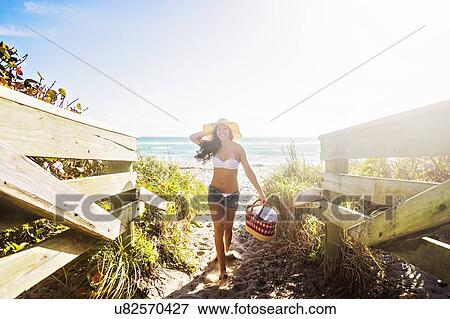 Portrait of young woman on beach View Large Photo Image Stock Photo - Portrait of young woman on beach. Fotosearch