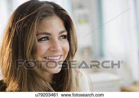 Stock Image - Portrait of young woman. Fotosearch