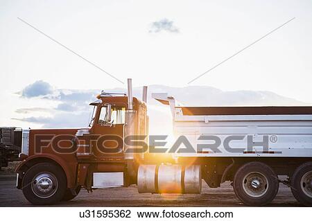 Red semi-truck on road View Large Photo Image Stock Image - Red semi-truck on road. Fotosearch