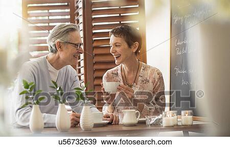 Senior couple talking at restaurant View Large Photo Image Stock Photo - Senior couple talking at restaurant. Fotosearch