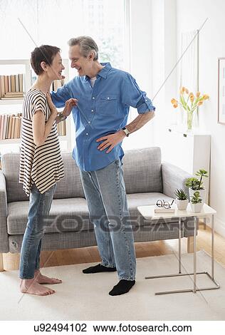 Senior couple talking in living room View Large Photo Image Stock Image - Senior couple talking in living room. Fotosearch